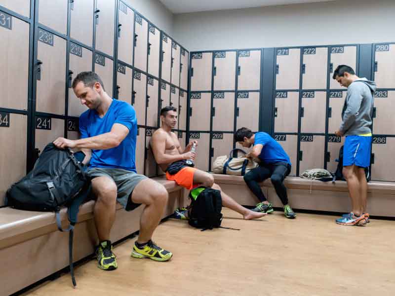 Men changing in the locker room at the gym
